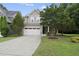 Charming two-story home featuring a two-car garage and well-manicured front yard at 2904 Britmass Dr, Raleigh, NC 27616