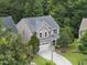 Two-story traditional home with a two-car garage, neutral siding, landscaped yard, and mature trees at 2904 Britmass Dr, Raleigh, NC 27616