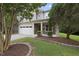 Beautifully landscaped home with stone accents and a well-maintained lawn at 2904 Britmass Dr, Raleigh, NC 27616