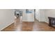 Open hallway with hardwood floors leading to a living space and stairs at 2904 Britmass Dr, Raleigh, NC 27616