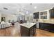 Open kitchen featuring granite countertops, stainless steel appliances, and hardwood floors at 2904 Britmass Dr, Raleigh, NC 27616