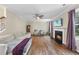 Open living room featuring a fireplace, hardwood floors, neutral paint and ample natural light at 2904 Britmass Dr, Raleigh, NC 27616
