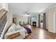 Inviting living room with wood floors, fireplace, large windows, and a comfortable seating area at 2904 Britmass Dr, Raleigh, NC 27616
