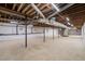 Spacious unfinished basement with concrete floor and exposed ceiling at 3006 Pump Station Ln, Durham, NC 27712