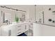Modern bathroom with double sinks, decorative tile, and frameless glass shower at 3006 Pump Station Ln, Durham, NC 27712