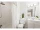 Bright white bathroom features tiled shower, white vanity, toilet, and decor at 3006 Pump Station Ln, Durham, NC 27712