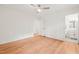 Spacious bedroom with hardwood floors leading to an en-suite bathroom with modern fixtures at 3006 Pump Station Ln, Durham, NC 27712