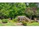 Scenic waterfall feature at the River's Edge community entrance with lush landscaping and stone accents at 3006 Pump Station Ln, Durham, NC 27712