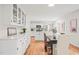 Inviting dining room space with hardwood floors and a modern kitchen at 3006 Pump Station Ln, Durham, NC 27712