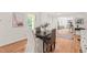 Charming dining room with hardwood floors and a view to the front entrance at 3006 Pump Station Ln, Durham, NC 27712