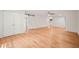 Open-concept living area with hardwood floors, barn door, and abundant natural light at 3006 Pump Station Ln, Durham, NC 27712