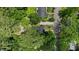 Aerial view of the home nestled among verdant trees in a residential neighborhood at 308 Greenwood Dr, Durham, NC 27704