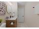Bathroom with modern vanity, stylish mirror, and neutral color scheme at 308 Greenwood Dr, Durham, NC 27704