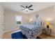 Comfortable bedroom with ceiling fan, natural light from the window, and blue accents at 308 Greenwood Dr, Durham, NC 27704