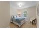 Cozy bedroom with a comfortable bed, soft lighting, and a view from the window at 308 Greenwood Dr, Durham, NC 27704