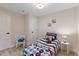 A cozy bedroom features a comfy bed, white walls, and wood floors at 308 Greenwood Dr, Durham, NC 27704