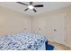 Neutral bedroom with ceiling fan, and three interior doors to closet and bathroom at 308 Greenwood Dr, Durham, NC 27704