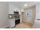 Updated kitchen featuring stainless steel appliances, granite countertops and stylish backsplash at 308 Greenwood Dr, Durham, NC 27704