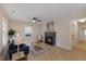 Cozy living room featuring a fireplace, wood floors, and neutral paint at 308 Greenwood Dr, Durham, NC 27704