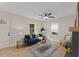 Bright living room with fan, wood floors, fireplace and natural light at 308 Greenwood Dr, Durham, NC 27704