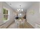 Open floor plan showcasing the dining area flowing into a cozy living room with fireplace at 308 Greenwood Dr, Durham, NC 27704