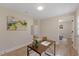Office with a wood desk and decorative accessories, next to a bedroom view at 308 Greenwood Dr, Durham, NC 27704