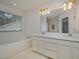 Bright bathroom showcasing a large soaking tub beneath a window and double sink vanity at 313 Teresa Dr, Rolesville, NC 27571