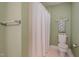 Cozy bathroom featuring a white shower curtain and neutral green walls at 313 Teresa Dr, Rolesville, NC 27571