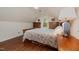 Cozy bedroom featuring hardwood floors, an angled ceiling, and bright natural light at 313 Teresa Dr, Rolesville, NC 27571