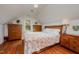 Cozy bedroom featuring wood furniture, a window view, and hardwood floors at 313 Teresa Dr, Rolesville, NC 27571
