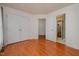 Bedroom with hardwood floors, bright natural light, and an ensuite bathroom at 313 Teresa Dr, Rolesville, NC 27571