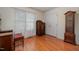 Bedroom with hardwood floors, bright natural light, and classic antique furnishings at 313 Teresa Dr, Rolesville, NC 27571