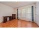 Empty bedroom with hardwood floors, bright natural light, and simple furnishings at 313 Teresa Dr, Rolesville, NC 27571