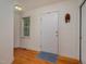 Bright entryway featuring hardwood floors, a front door, and a window at 313 Teresa Dr, Rolesville, NC 27571