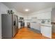 Bright kitchen with stainless steel appliances and white cabinets at 313 Teresa Dr, Rolesville, NC 27571
