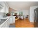 Open-concept kitchen and dining area with a hardwood floor at 313 Teresa Dr, Rolesville, NC 27571