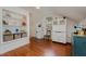 Efficient kitchenette space with white appliances, open shelving and hardwood floors at 313 Teresa Dr, Rolesville, NC 27571