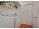 Functional laundry room with a washer, dryer, and storage at 313 Teresa Dr, Rolesville, NC 27571