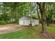 Detached two-car garage with concrete driveway and tree-lined surroundings at 313 Teresa Dr, Rolesville, NC 27571