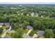 Aerial view showcasing the neighborhood's mature trees and well-maintained landscaping at 317 Chanticlair Dr, Apex, NC 27502