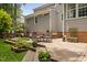 Multi-tiered wooden deck offers space for dining, grilling, and lounging in this beautiful backyard at 317 Chanticlair Dr, Apex, NC 27502