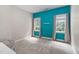 This bedroom has teal and gray walls and neutral carpet at 317 Chanticlair Dr, Apex, NC 27502