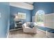 Bedroom with a white chair, blue walls, neutral carpet and window at 317 Chanticlair Dr, Apex, NC 27502