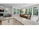 Dining area with table and seating adjacent to the kitchen and living room at 317 Chanticlair Dr, Apex, NC 27502