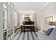 Well-lit home office with a large desk, comfortable seating, and elegant decor at 317 Chanticlair Dr, Apex, NC 27502
