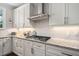 Well-appointed kitchen featuring granite countertops, stainless steel appliances, and ample cabinet space at 317 Chanticlair Dr, Apex, NC 27502