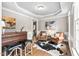 Elegant living room with dark wood floors, a bar area, and stylish decor at 317 Chanticlair Dr, Apex, NC 27502
