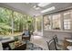 Relaxing screened-in porch offers lots of natural light and views of the private backyard space at 317 Chanticlair Dr, Apex, NC 27502