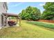 Backyard featuring a patio area with outdoor furniture, a grill and a well-manicured lawn at 326 Hope Valley Rd, Knightdale, NC 27545