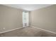 Neutral-toned bedroom with plush carpeting and a bright window at 326 Hope Valley Rd, Knightdale, NC 27545